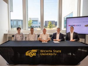 Members from NIAR and Knowmadics sign the collaboration agreement