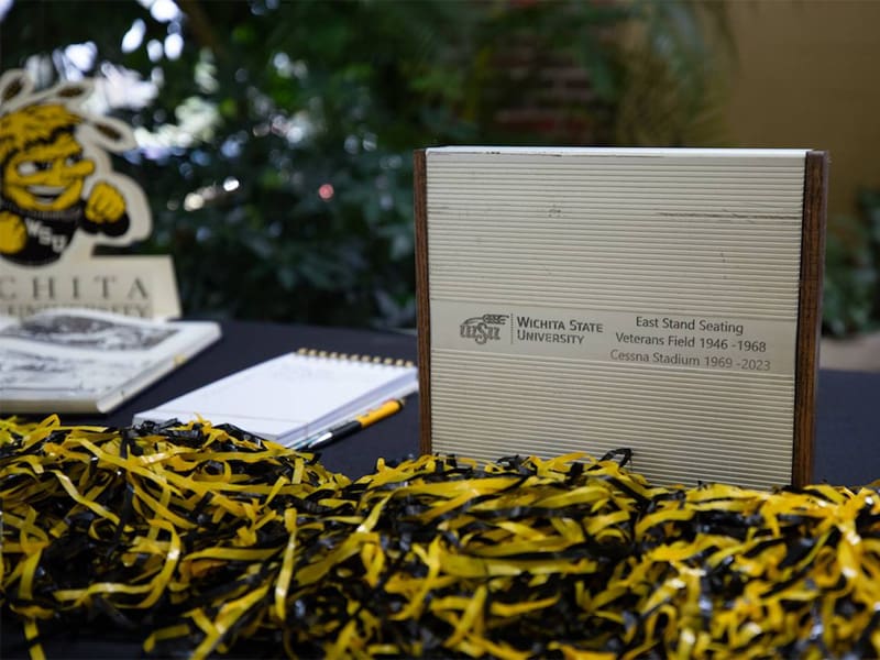 One of the Memorial '70 plaques surrounded by Wichita State items