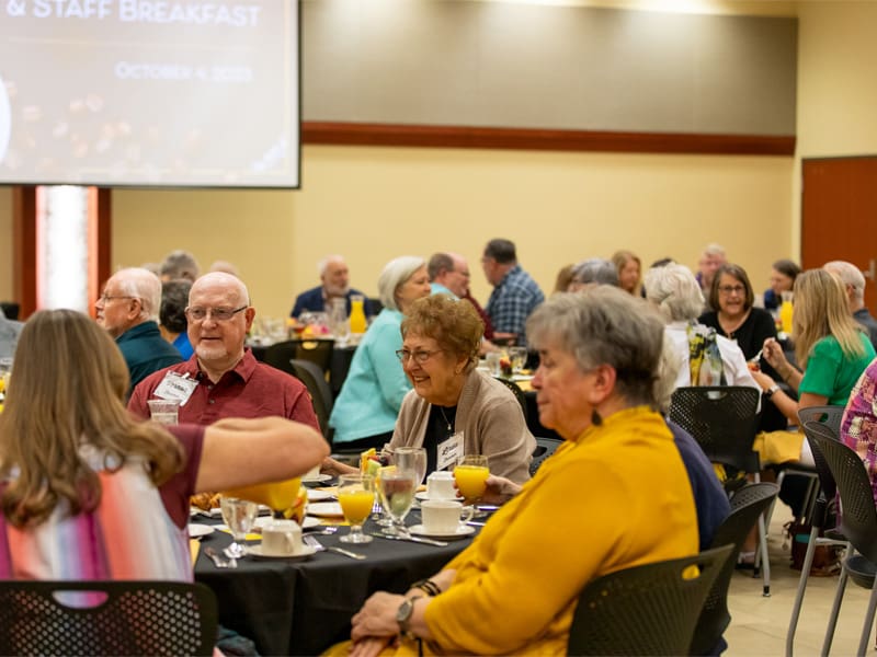 Retirees mingling at the WSU Retiree Association announcement