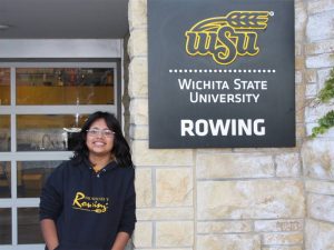 Keydy Sebastian-Perez poses with the Shocker rowing sign