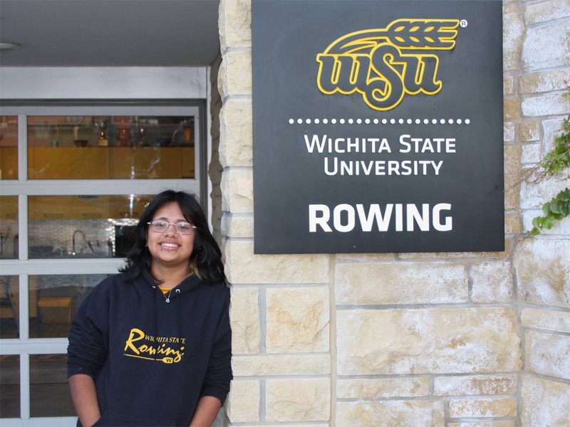 Keydy Sebastian-Perez poses with the Shocker rowing sign