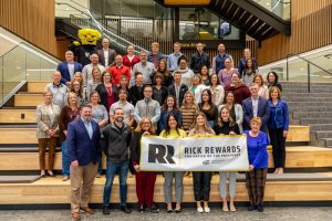 President Rick Muma and Wu pose with staff from the Foundation and Alumni Engagement for Rick Rewards