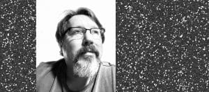 A middle aged white man, author Brian Turner, is pictured.