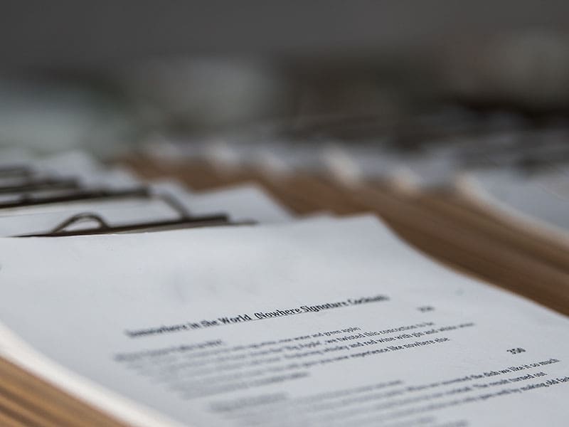 Decorative image of stacks of documents