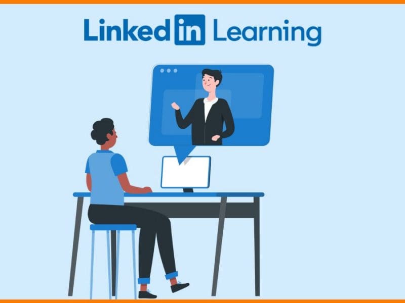 Person sitting at a computer watching a LinkedIn Learning video course.