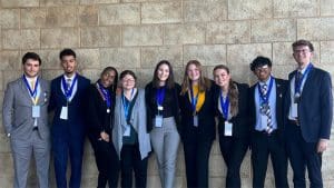 Collegiate DECA chapter at Wichita State University members George Giem, Tayshaun Washington, Valishia Landrum, Nivea, Raven McPherson, Grace Skelton, Maley Hansen, Ronish Rasaily, and Nathan Holloway.
