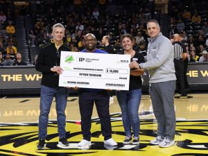 President Rick Muma, Kevin Saal and members of United Way present the money raised for the United Way Champions for Literacy 2024 campaign