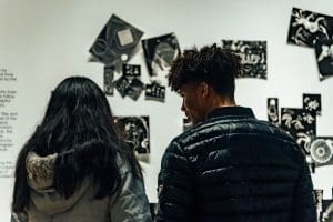 A couple looks at artwork in the Ulrich galleries.