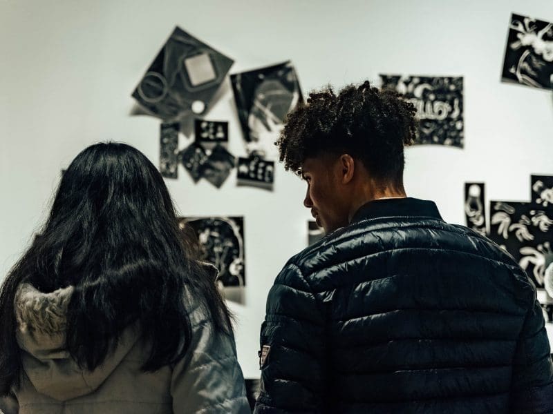 A couple looks at artwork in the Ulrich galleries.