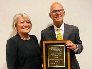 Dr. Dean Elledge with the Dentist of the Year award