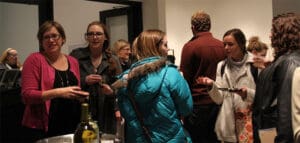 Students enjoy a reception for Creative Writing MFA graduates.