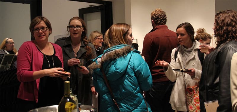 Students enjoy a reception for Creative Writing MFA graduates.