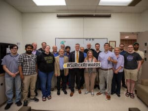 President Rick Muma poses with the WSU physics department for Rick Rewards
