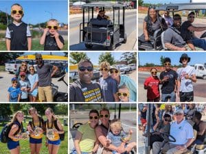 visitors and volunteers pose for photos at state athletics events on campus.