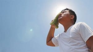A man towels off under the summer heat