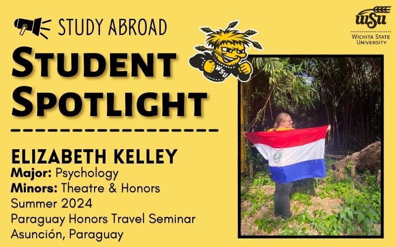 There is a photo of Elizabeth Kelley in Paraguay with a Paraguayan flag wrapped around her back and she is standing in front of many eucalyptus trees. There is also information about Elizabeth Kelley. Her major is Psychology and her minors are Honors and Theatre. She studied abroad summer 2024 in Asuncion Paraguay with the Paraguay Honors Travel Seminar