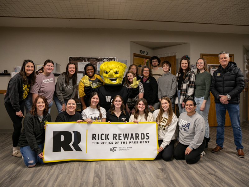 President Rick Muma and WuShock post with the staff of the Child Development Center Jan. 17 for Rick Rewards