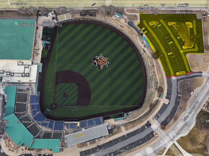 An overhead photo of Eck Stadium with the closed parking lot highlighted in yellow in the top right corner