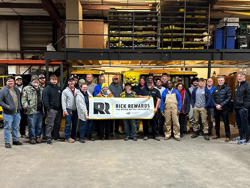 President Rick Muma, first gentleman Rick Case and WuShock pose with members of Landscaping and Ground Maintenance for February 2025's Rick Rewards.