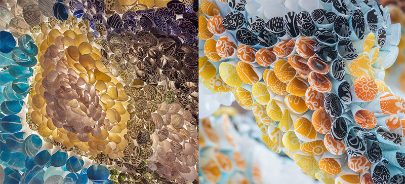 Abstract artwork made from printed, rolled paper plates arranged in a honeycomb-like pattern