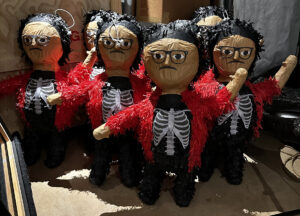 Piñatas of the artist Justin Favela are gathered in a group