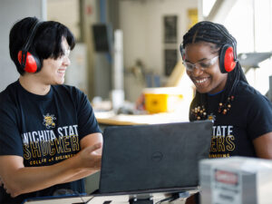 Wichita State engineering students collaborate on a prototype at the Project Innovation Hub.