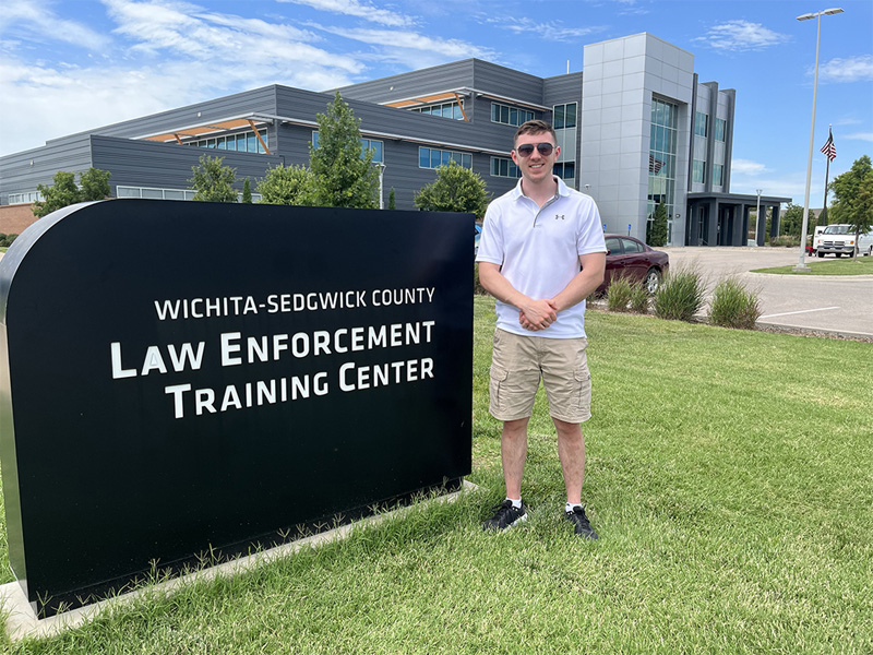Carter Duff standing outside the Wichita-Sedgwick County Law Enforcement Training Center