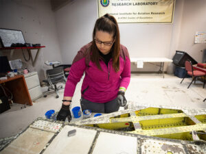 A Wichita State University student conducts materials research for steel at the National Institute for Aviation Research.