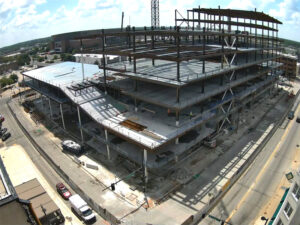 Overhead view of the construction site of the Wichita Biomedical Campus in downtown Wichita, showing multiple levels in various stages of construction, with some having concrete floors, steel floors and still open