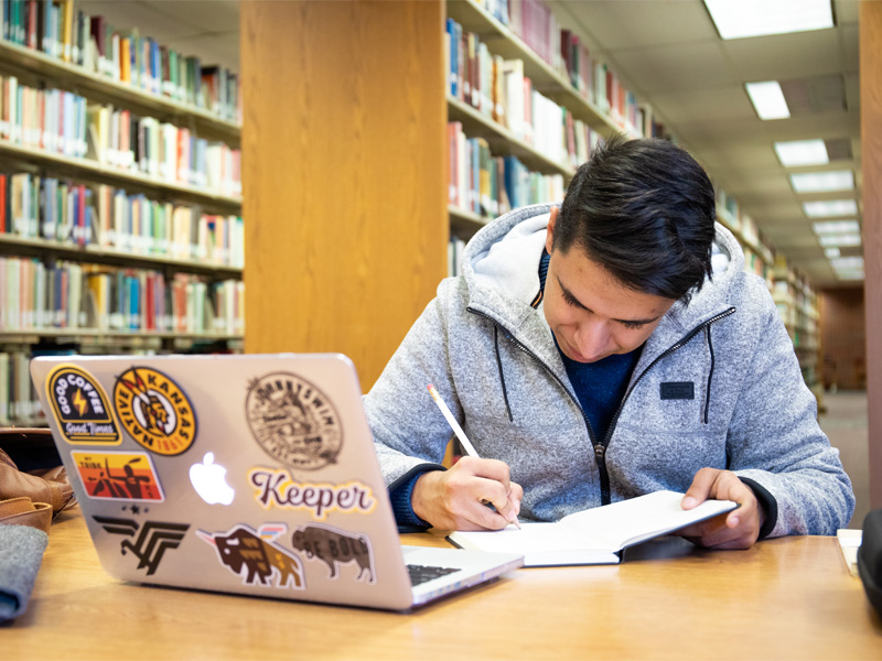A student studies for their class in Ablah Library on campus