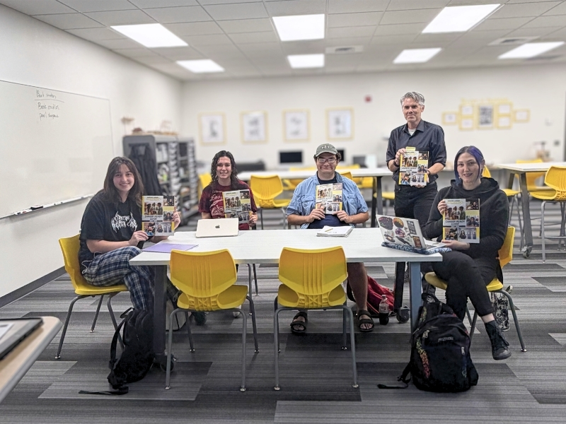 English Career Seminar Class Holding Their Career Ready Guide Textbook