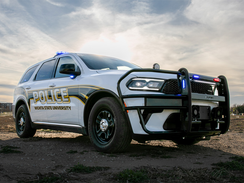 A University Police Department car situated near the Wichita State sign on 21st and Oliver