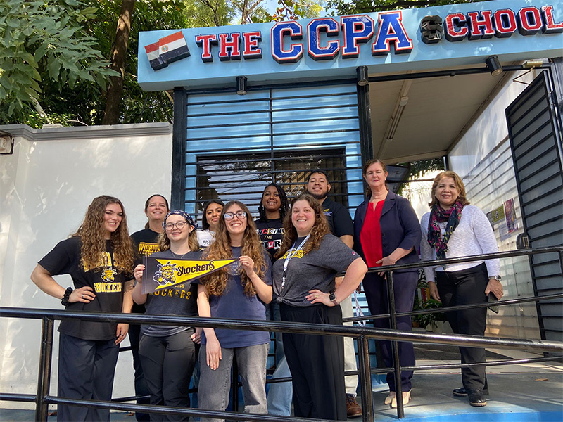 Students pose in front of the CCPA School in Paraguay