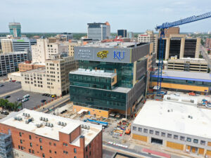 Drone photo of the Wichita Biomedical Campus, highlighting the new sign that reads "Wichita Biomedical Campus" beside the WSU and KU logos