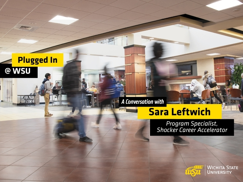 Students walk through a busy indoor campus commons area at Wichita State University. Several people are shown moving across the foreground with motion blur, while others sit and study at tables in the background. Overlay text reads "Plugged In @ WSU" and "A Conversation with Sara Leftwich, Program Specialist, Shocker Career Accelerator" The Wichita State University logo appears in the lower-right corner. The image promotes a podcast episode featuring WSU Success Coaches and highlights student activity and engagement on campus.