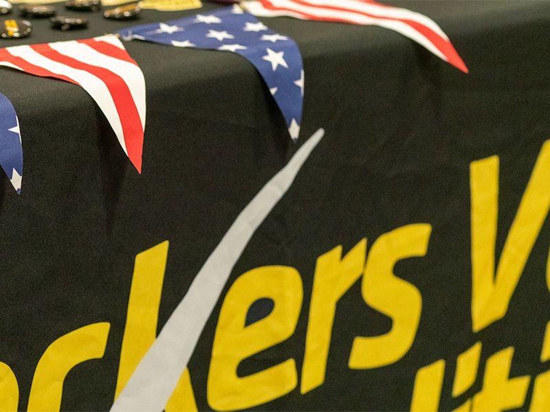 Shows a photo of a shockers vote booth aligned with American flags