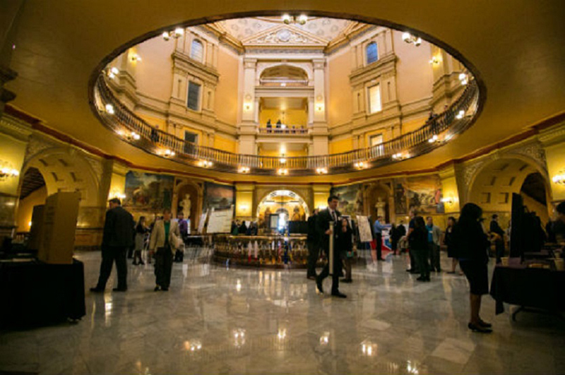 Graduate students presenting in capitol rotunda Graduate students presenting in capitol rotunda